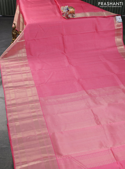 Pure kanchipuram silk saree peach pink with allover zari woven butta weaves and long zari woven korvai border