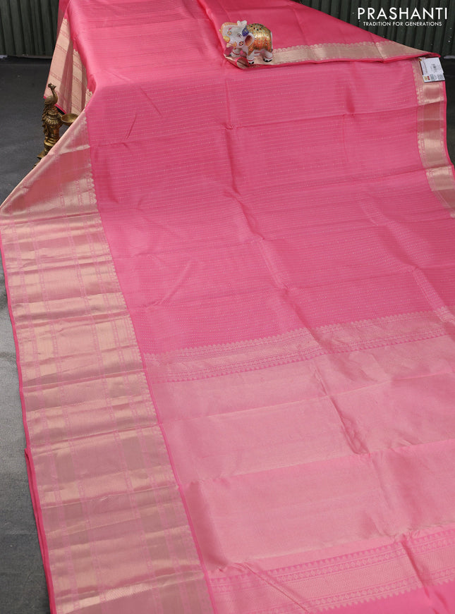 Pure kanchipuram silk saree peach pink with allover zari woven butta weaves and long zari woven korvai border