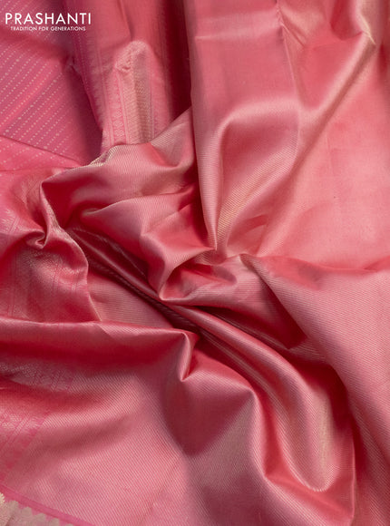 Pure kanchipuram silk saree peach pink with allover zari woven butta weaves and long zari woven korvai border