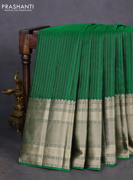 Pure kanchipuram silk saree green and mauve pink with allover zari woven butta weaves and long zari woven korvai border
