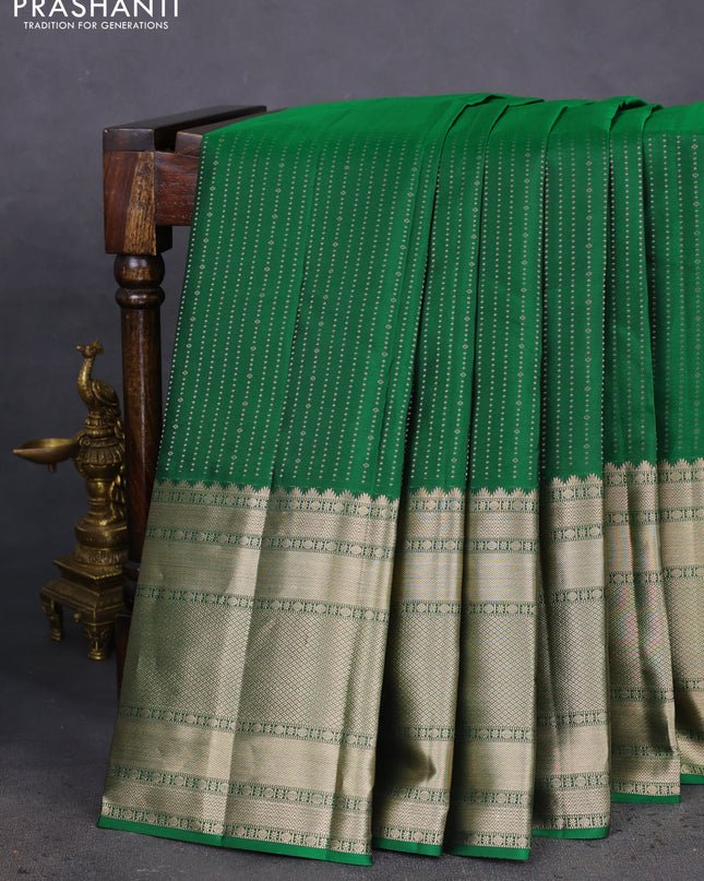 Pure kanchipuram silk saree green and mauve pink with allover zari woven butta weaves and long zari woven korvai border