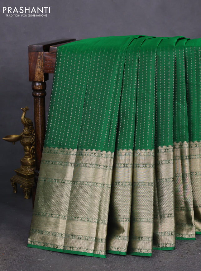 Pure kanchipuram silk saree green and mauve pink with allover zari woven butta weaves and long zari woven korvai border
