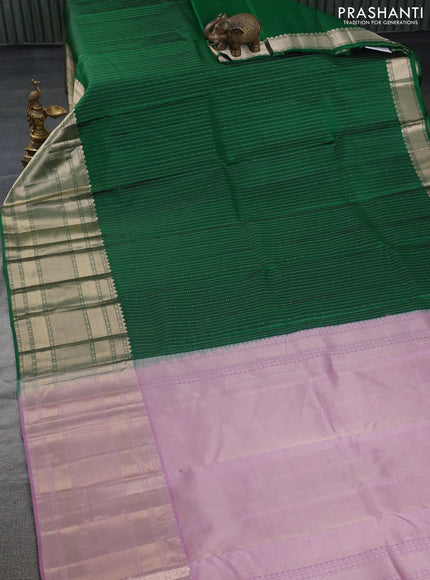 Pure kanchipuram silk saree green and mauve pink with allover zari woven butta weaves and long zari woven korvai border