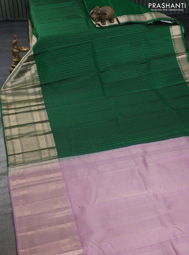 Pure kanchipuram silk saree green and mauve pink with allover zari woven butta weaves and long zari woven korvai border