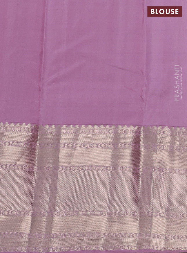 Pure kanchipuram silk saree green and mauve pink with allover zari woven butta weaves and long zari woven korvai border