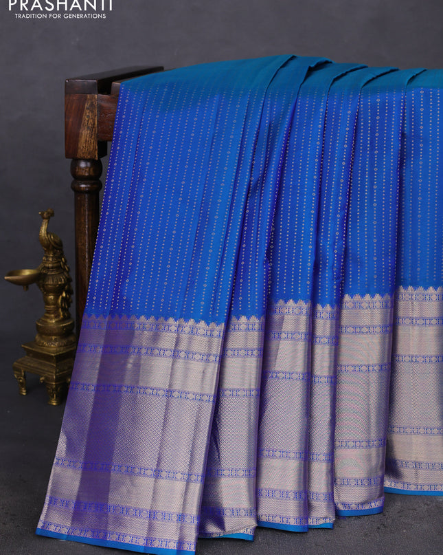 Pure kanchipuram silk saree dual shade of bluish green and pastel pink with allover zari woven butta weaves and long zari woven korvai border