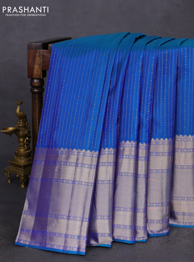 Pure kanchipuram silk saree dual shade of bluish green and pastel pink with allover zari woven butta weaves and long zari woven korvai border