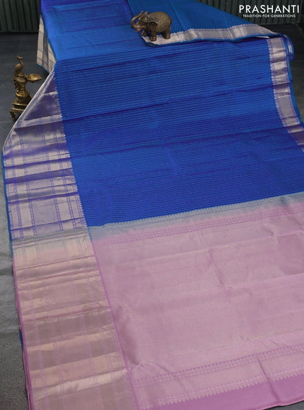 Pure kanchipuram silk saree dual shade of bluish green and pastel pink with allover zari woven butta weaves and long zari woven korvai border