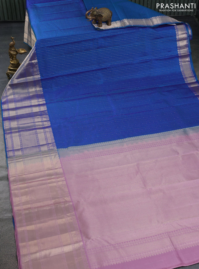 Pure kanchipuram silk saree dual shade of bluish green and pastel pink with allover zari woven butta weaves and long zari woven korvai border