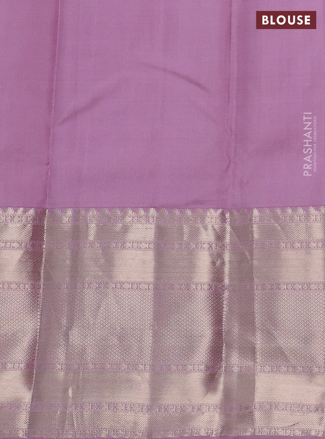 Pure kanchipuram silk saree dual shade of bluish green and pastel pink with allover zari woven butta weaves and long zari woven korvai border