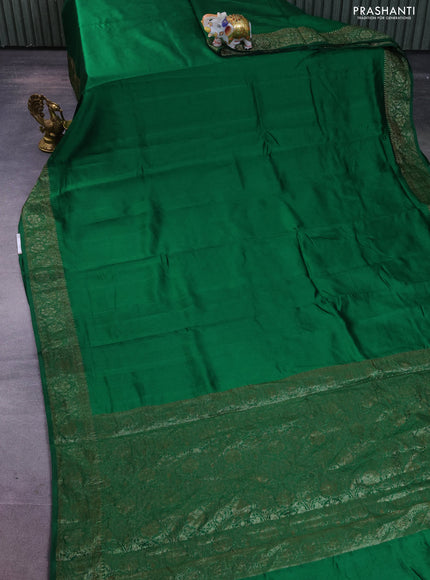 Chiniya silk saree green with plain body and woven border