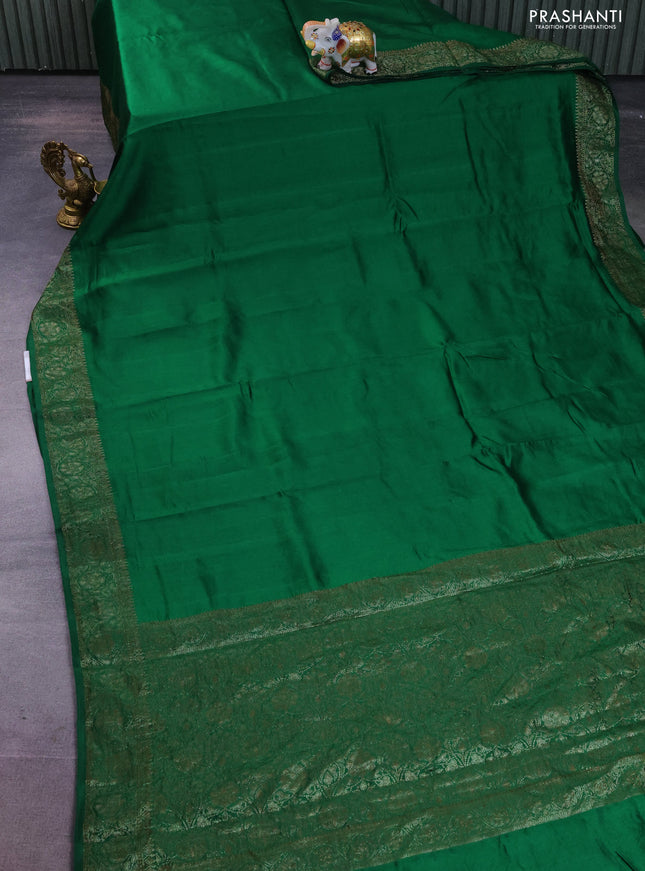 Chiniya silk saree green with plain body and woven border