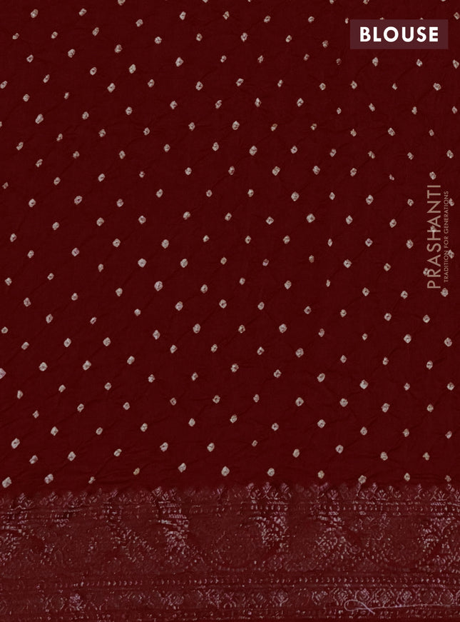 Chiniya silk saree maroon with plain body and woven border