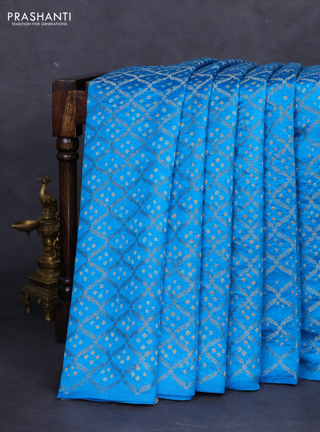 Chiniya silk saree cs blue with allover zari weaves & bandhini prints and zari woven border