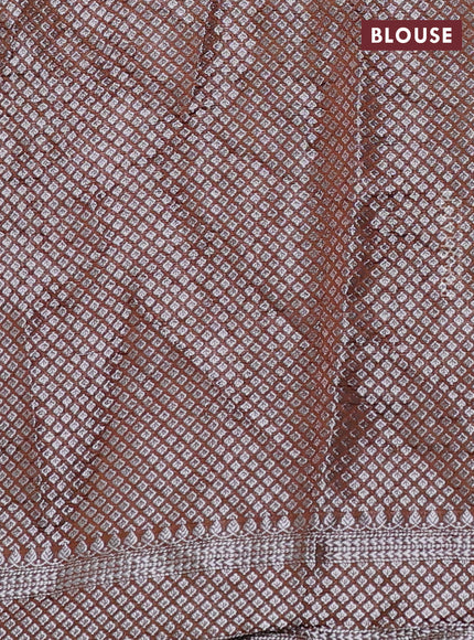 Chiniya silk saree rust shade with allover silver zari buttas & bandhini prints and silver zari woven border