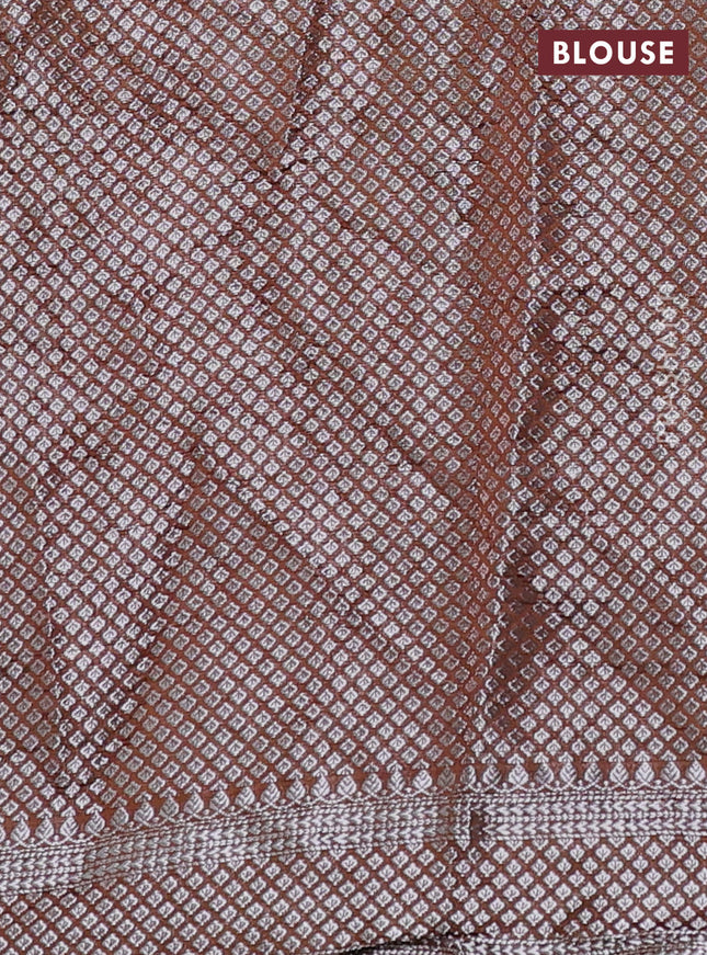 Chiniya silk saree rust shade with allover silver zari buttas & bandhini prints and silver zari woven border