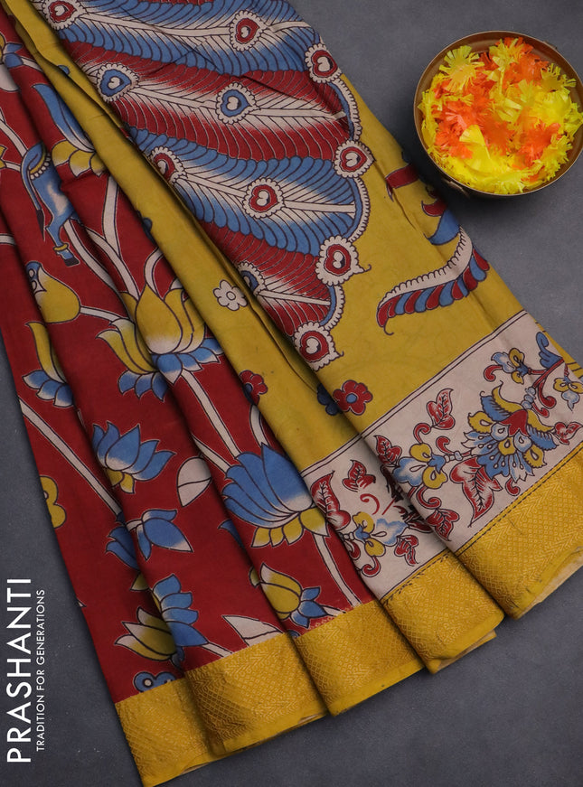 Kalamkari semi silk saree maroon and yellow with allover prints and zari woven border