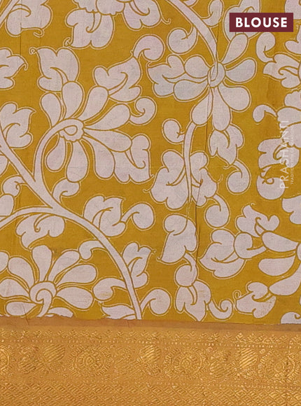 Kalamkari semi silk saree beige mustard yellow and multi colour with allover prints and zari woven border