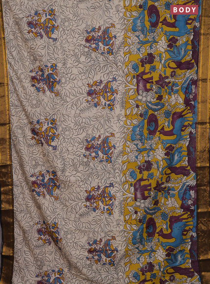 Kalamkari semi silk saree beige yellow and black with allover prints and zari woven border
