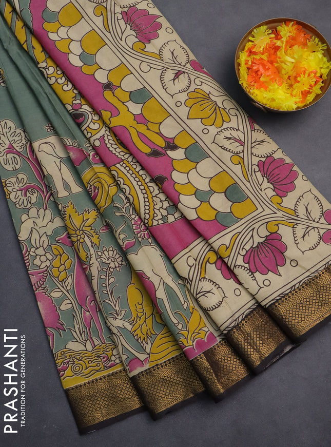 Kalamkari semi silk saree pastel green and black with allover prints and zari woven border