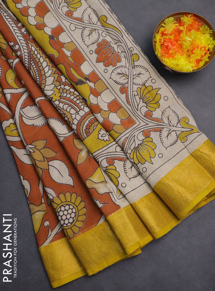 Kalamkari semi silk saree rust shade and yellow with allover prints and zari woven border