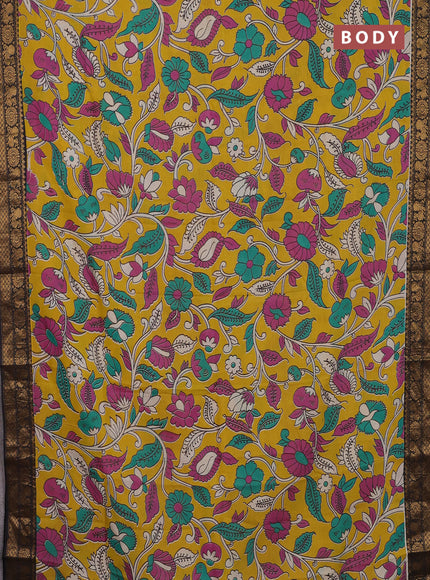 Kalamkari semi silk saree yellow and black with allover prints and zari woven border