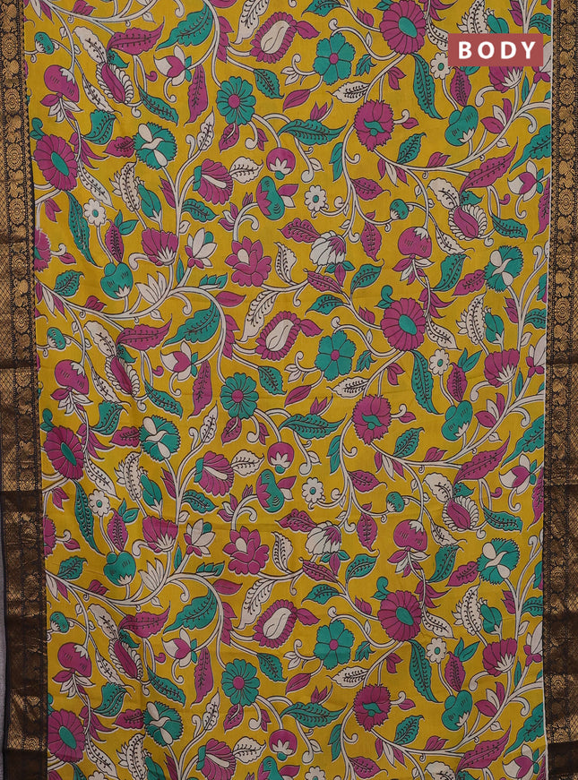Kalamkari semi silk saree yellow and black with allover prints and zari woven border