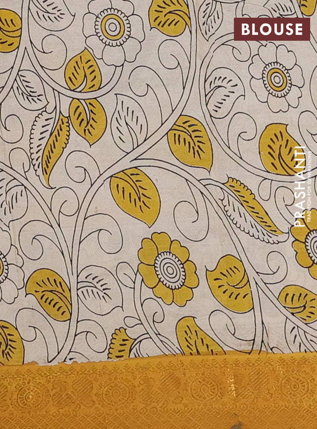 Kalamkari semi silk saree dark mustard and mustard yellow with allover prints and zari woven border