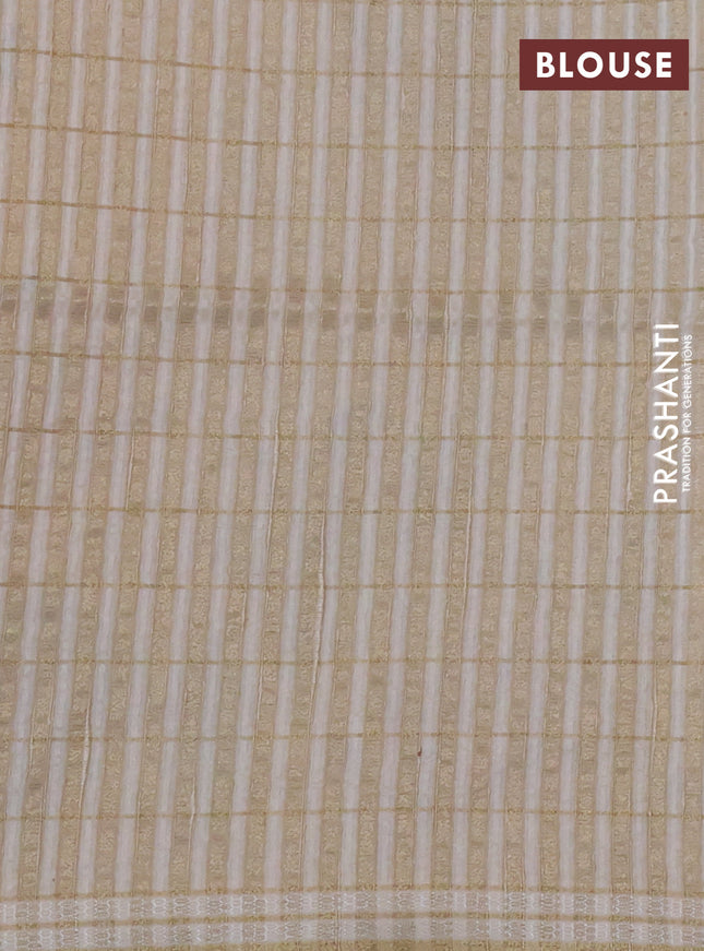 Semi tussar saree cream with allover zari checks & digital prints and zari woven border