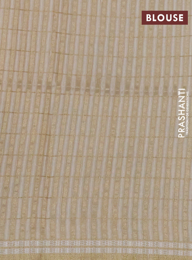 Semi tussar saree sandal with allover zari checks & digital prints and zari woven border