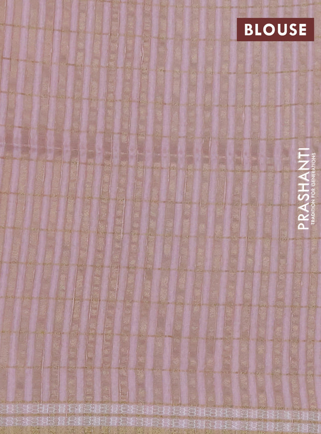 Semi tussar saree peach shade with allover zari checks & digital prints and zari woven border