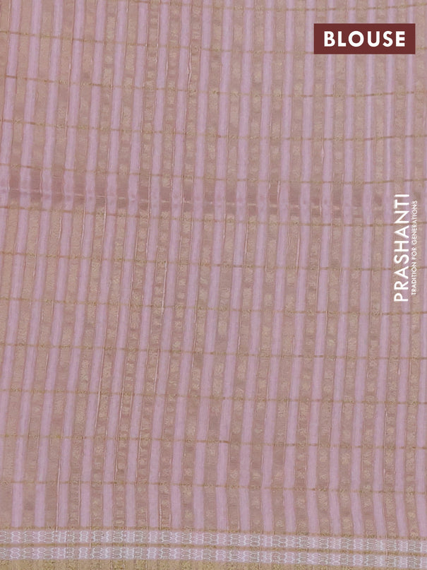 Semi tussar saree peach shade with allover zari checks & digital prints and zari woven border