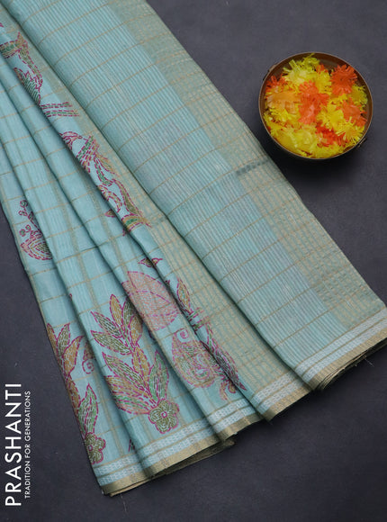 Semi tussar saree teal blue with allover zari checks & digital prints and zari woven border