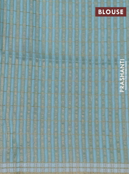 Semi tussar saree teal blue with allover zari checks & digital prints and zari woven border