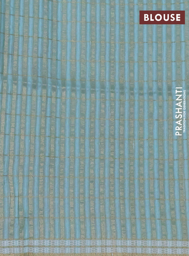 Semi tussar saree teal blue with allover zari checks & digital prints and zari woven border