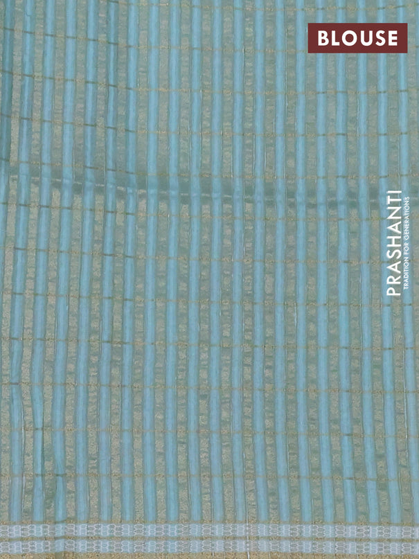 Semi tussar saree teal blue with allover zari checks & digital prints and zari woven border