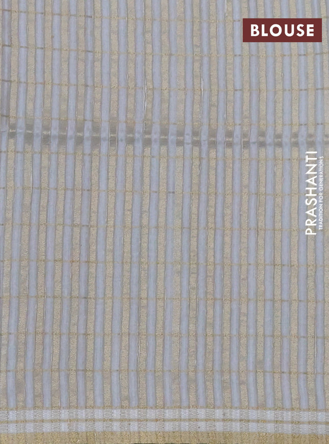 Semi tussar saree pastel grey with allover zari checks & digital prints and zari woven border