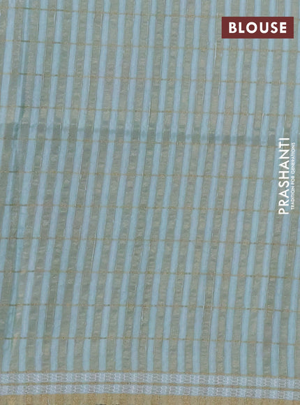 Semi tussar saree pastel green with allover zari checks & digital prints and zari woven border