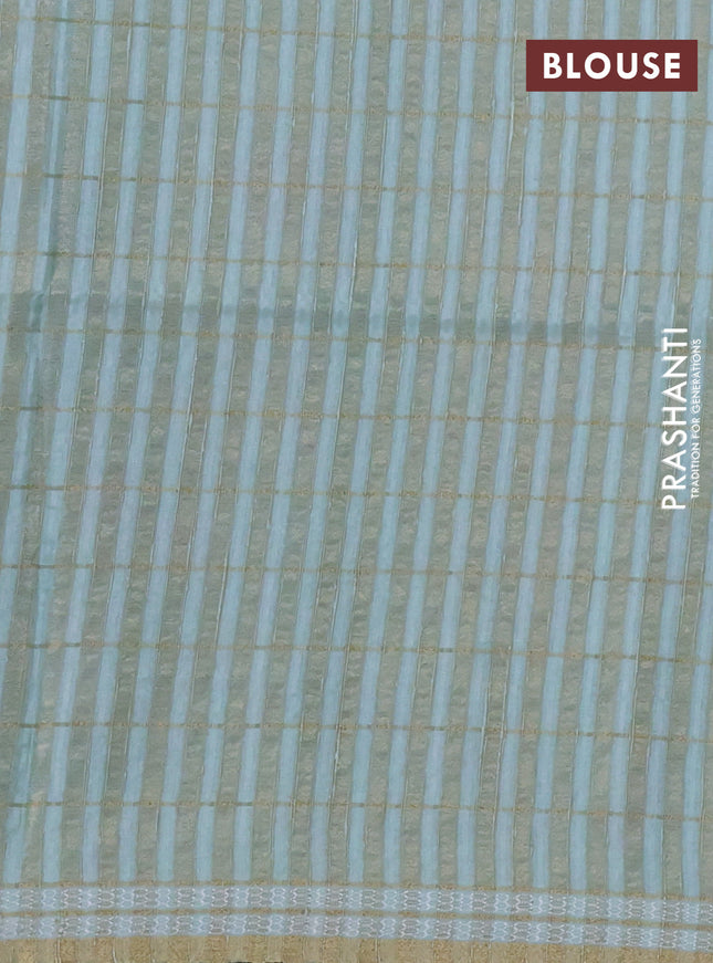 Semi tussar saree pastel green with allover zari checks & digital prints and zari woven border