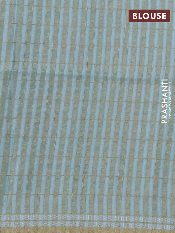 Semi tussar saree pastel green with allover zari checks & digital prints and zari woven border