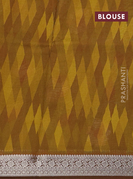 Tussar georgette silk saree mustard yellow and brown with allover digital prints and zari woven border
