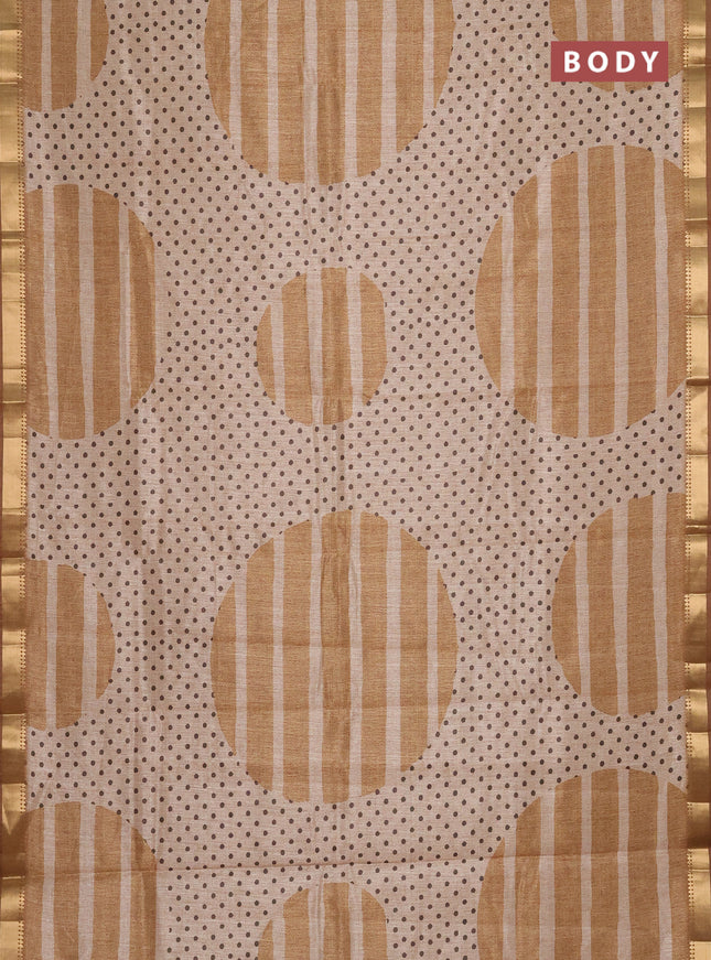 Semi tussar saree sandal and dark mustard with allover prints and zari woven border