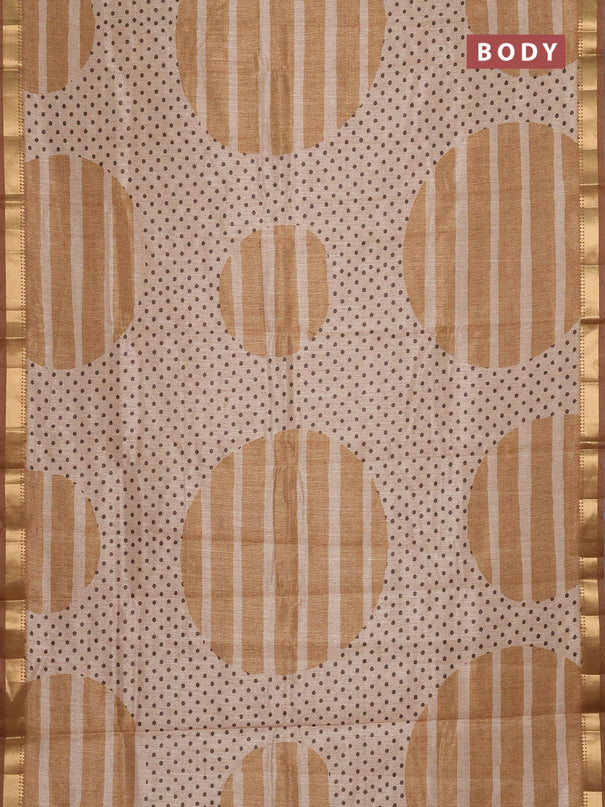 Semi tussar saree sandal and dark mustard with allover prints and zari woven border