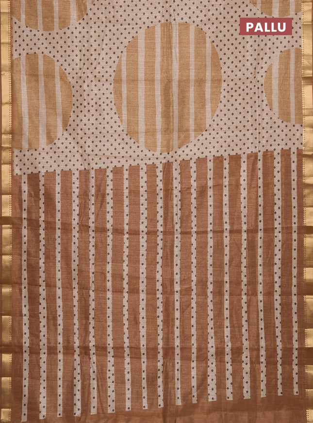 Semi tussar saree sandal and dark mustard with allover prints and zari woven border