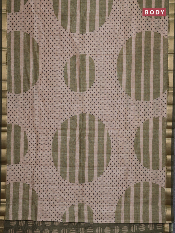 Semi tussar saree sandal and sap green with allover prints and zari woven border