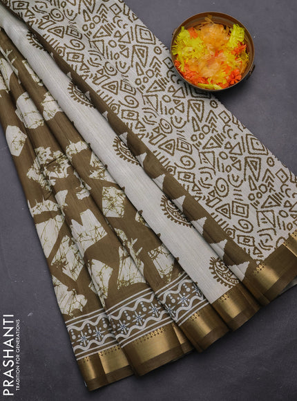 Semi tussar saree mehendi green and beige with allover geometric prints and zari woven border