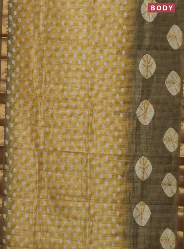 Semi tussar saree yellow and green shade with butta prints and zari woven border