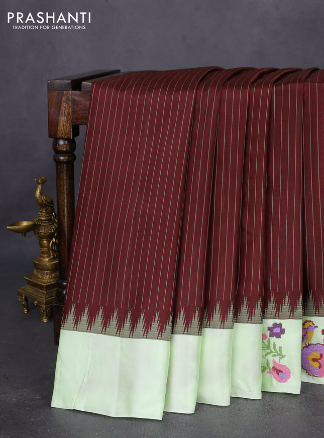Pure gadwal silk saree deep maroon and pista green with allover stripes pattern and embroided butta border