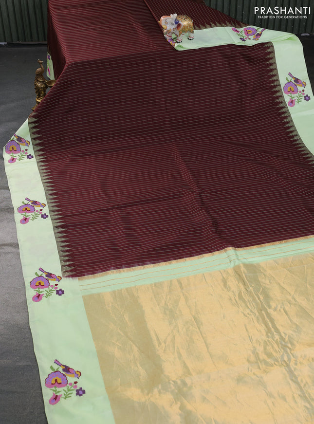 Pure gadwal silk saree deep maroon and pista green with allover stripes pattern and embroided butta border