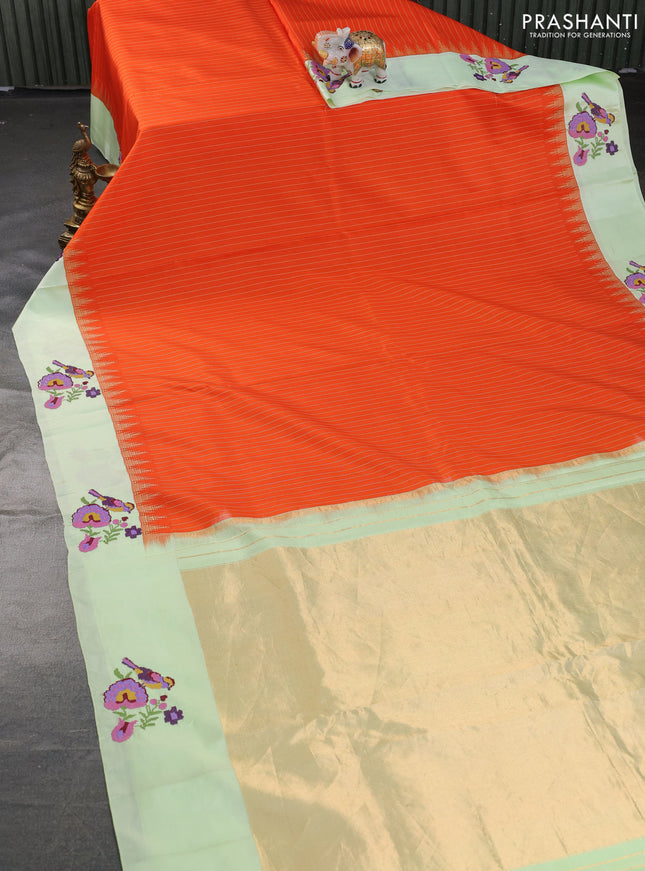 Pure gadwal silk saree orange and pista green with allover stripes pattern and embroided butta border